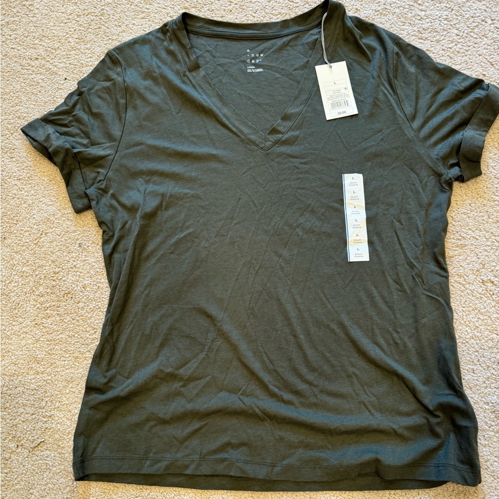 A New Day olive green short sleeve shirt. New with tags.